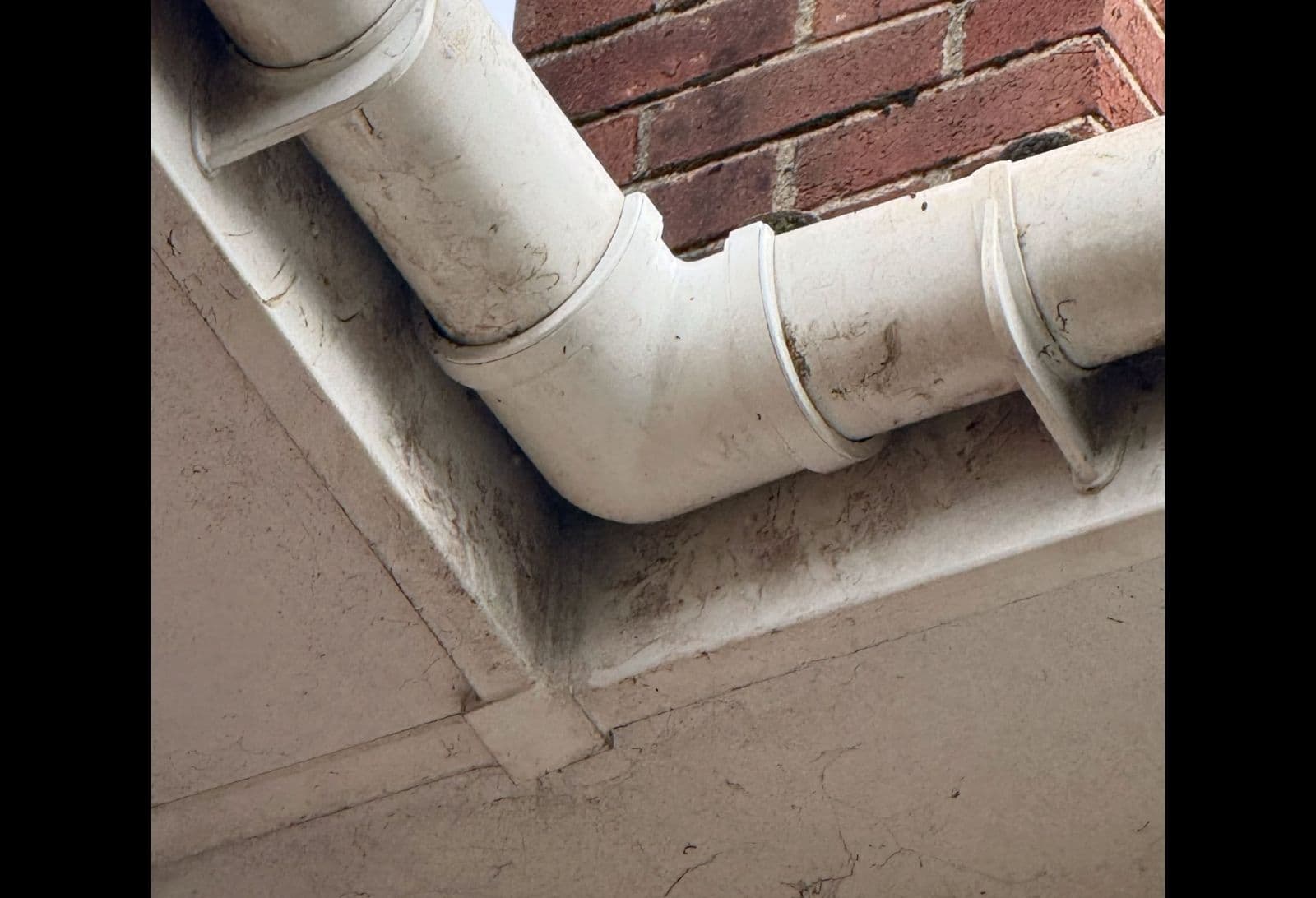 Old worn gutter corner joint before replacement
