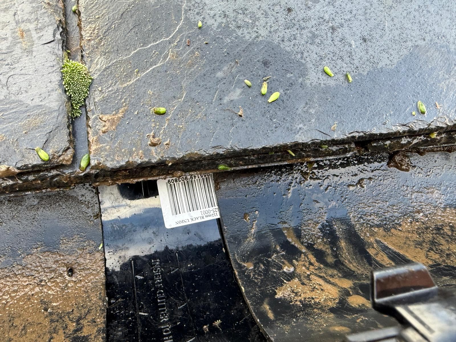 Close-up of a gutter joint being repaired with a new component fitted, Devon — Exeter